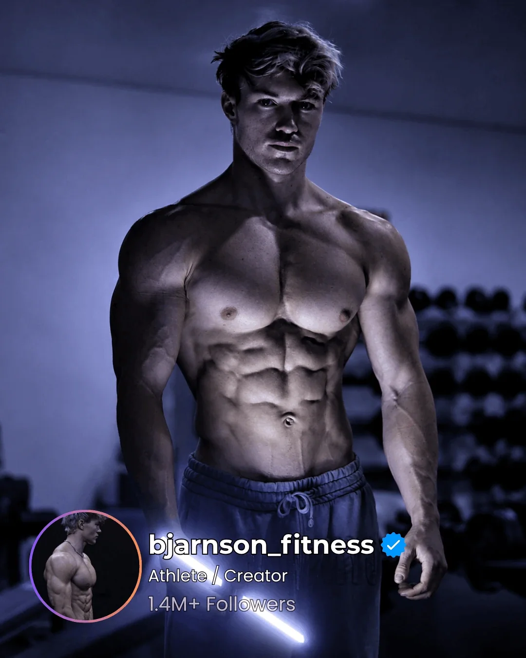 Athlete standing in a gym lit by a cool GYMLIGHT bar, chest and abs clearly separated